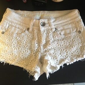 Crocheted floral jean shorts